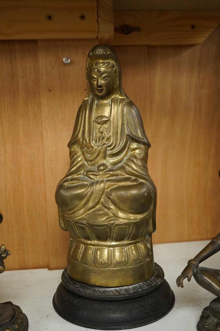 Three South East Asian brass figures to include one of Bodhisattva, largest 28cm high